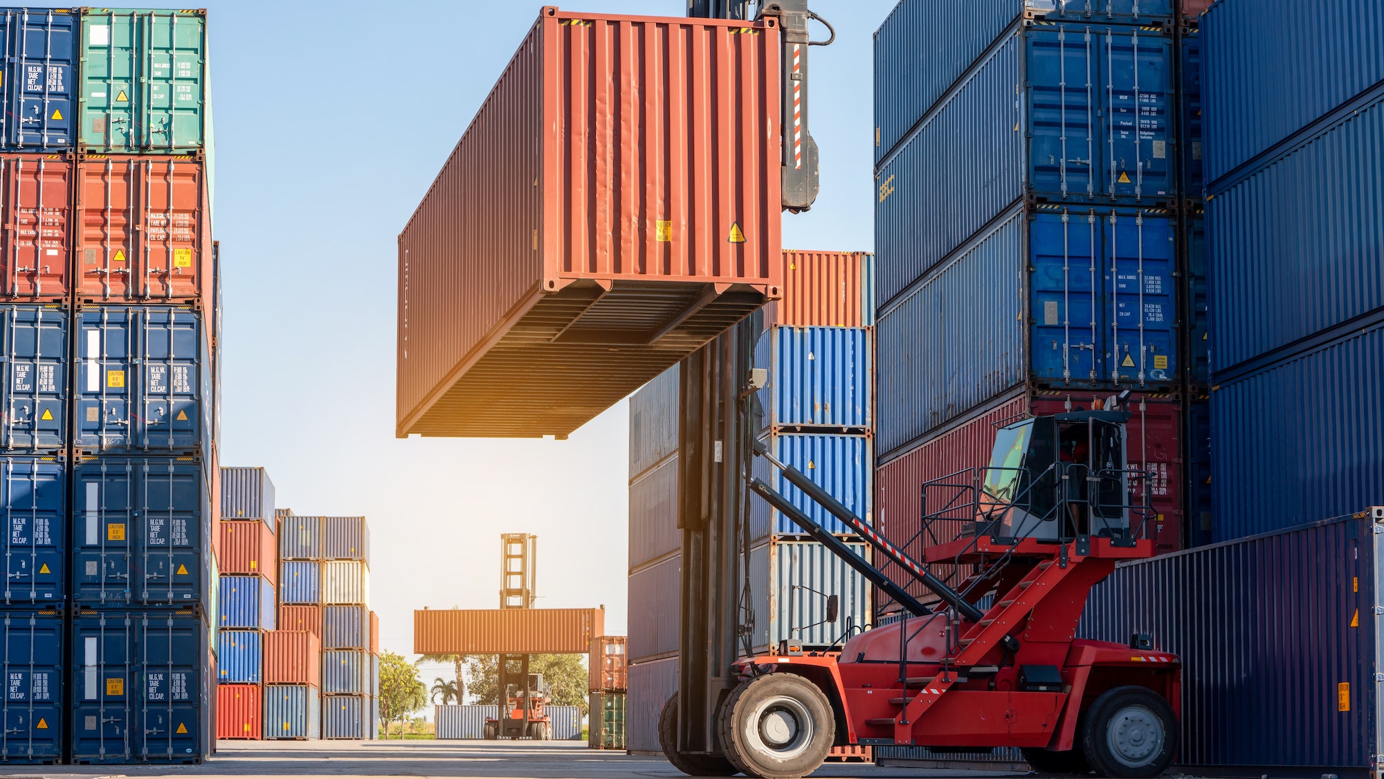 forklift working in the container cargo yard port loading cargo tank logistic service and transport